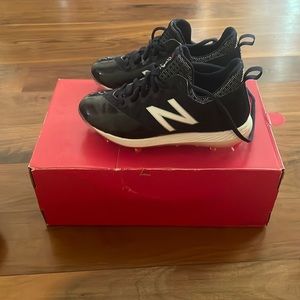 New Balance comp cleats